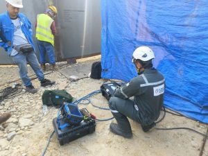 Phased Array Ultrasonic Testing (PAUT) device displaying weld flaw data